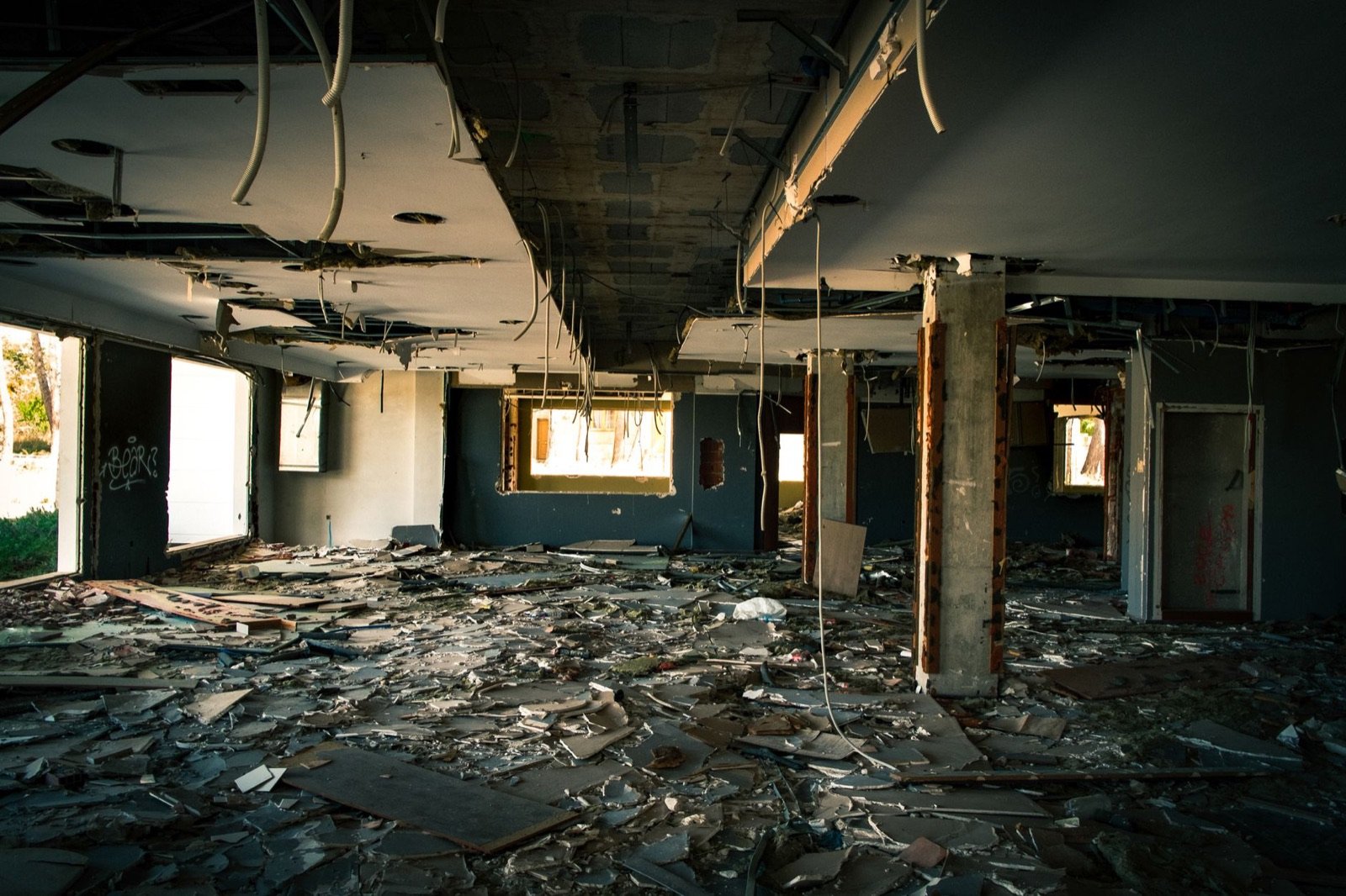 Interior of a large building affected by water and structural damage, the kind of large-loss site FixAIRx assesses