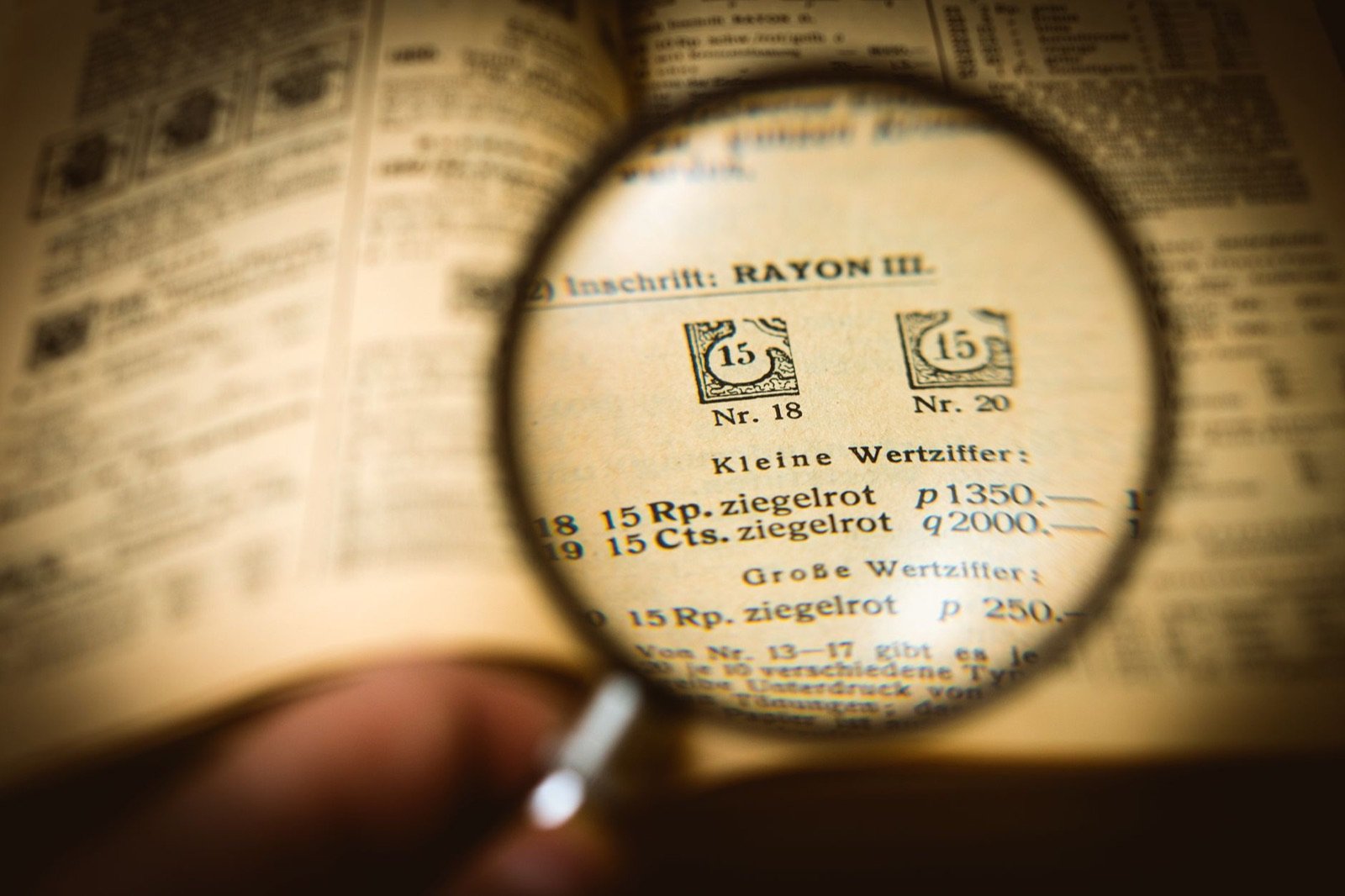 A magnifying glass over a document, representing clearance verification